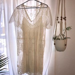 Loose flowing white lace dress